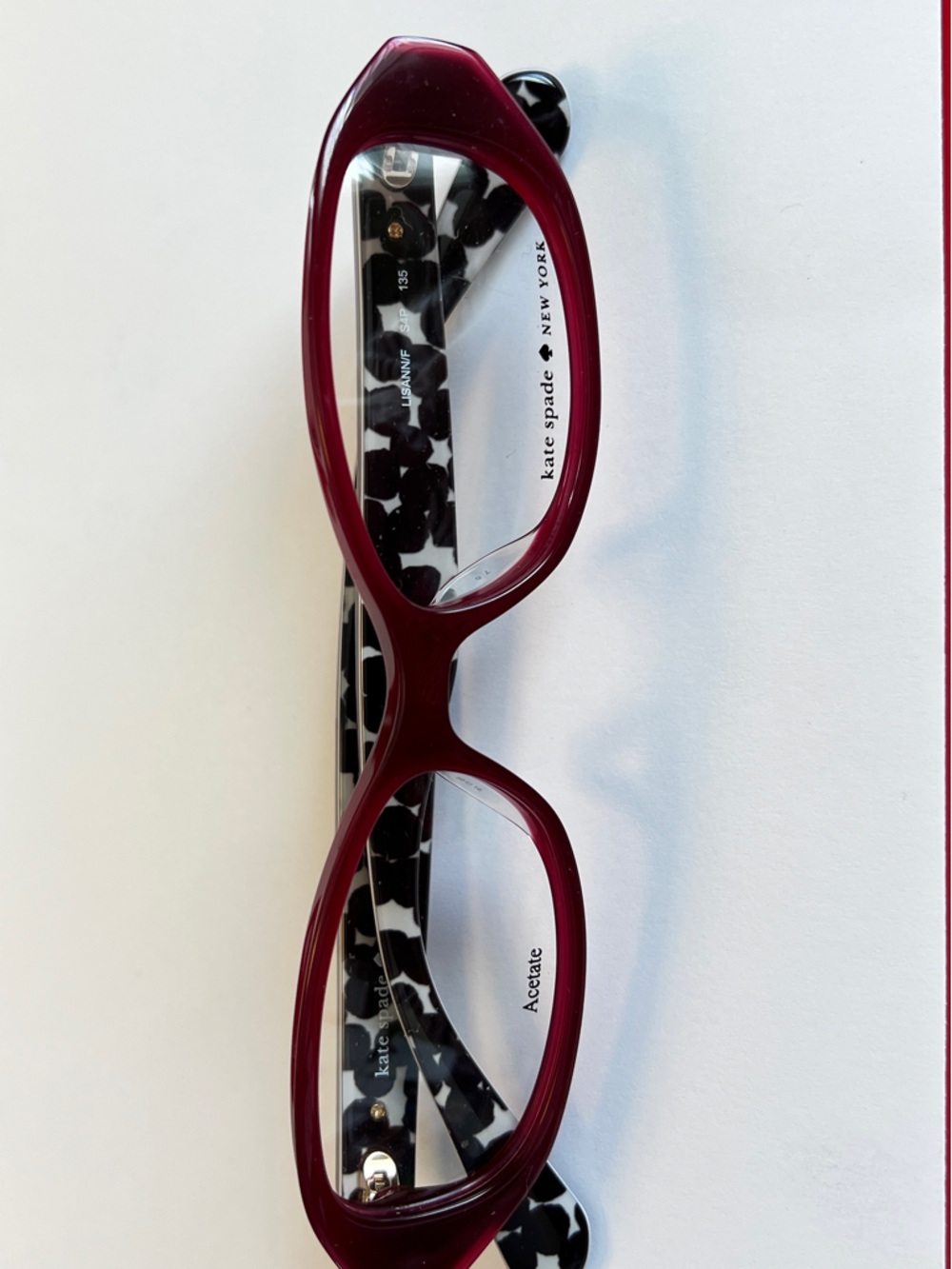 kate spade burgundy front with black-and-white patterned temples eyeglasses